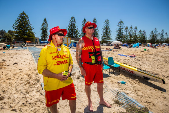 Altona Lifesaving Club captain Dominic Sancula (left) and patrol captain Jason Dalby on Altona beach as temperatures soar on Tuesday.