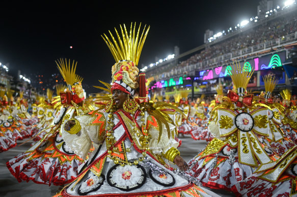 Members of Imperatriz Leopoldinense perform at the Sambadrome where samba schools are judged on their theme, song, costumes, floats, ensemble and cohesion.