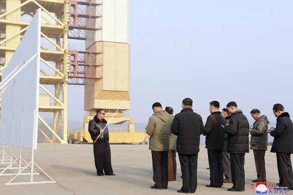 North Korean leader Kim Jong-un, holding pointer, visits the Sohae Satellite Launching Ground in Tongchang-ri, North Korea. Independent journalists were not given access to cover the event depicted in this image distributed by the North Korean government.