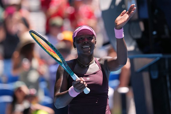 Victoria Mboko of Canada waves after defeating Clara Tauson of Denmark.