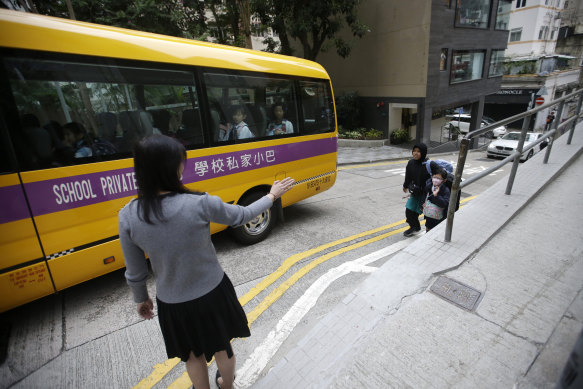 A child prepared to board the bus to school as classes reopened in Hong Kong.