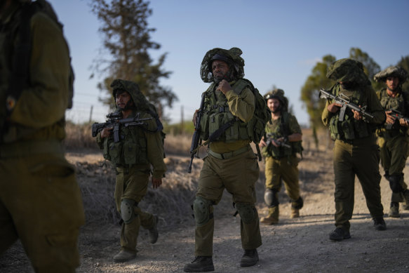 Israeli soldiers patrol near the border between Israel and Gaza Strip, Israel.
