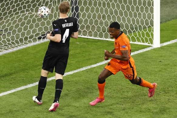 Denzel Dumfries celebrates the Netherlands’ second goal in Amsterdam.