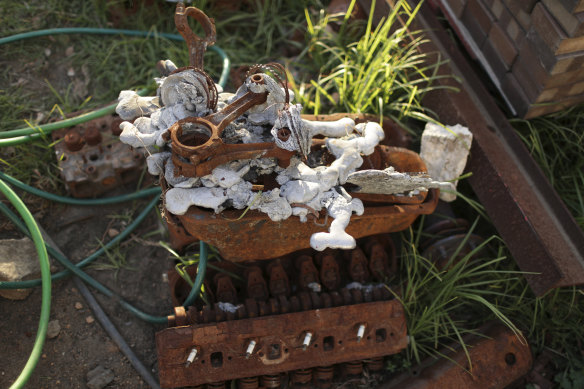 Melted car parts on the property of Brad and Gail Rayer.