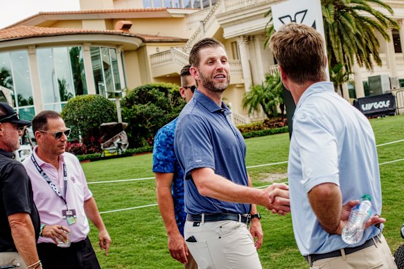 Eric Trump greeted a guest on the first day of LIV Golf’s tournament at Trump National Doral. 
