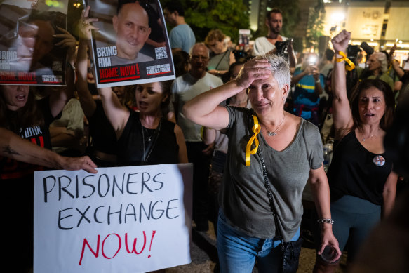 A relative of a hostage reacts during a rally calling for hostages to be released in the Tel Aviv Museum Plaza.