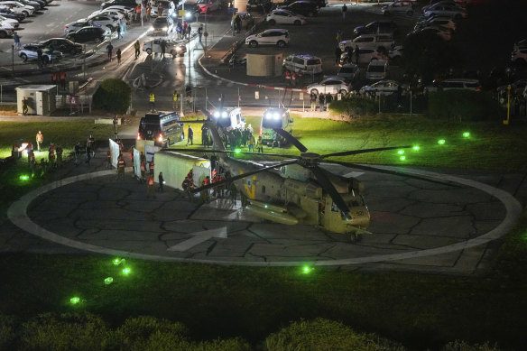 A helicopter carrying hostages released by Hamas lands at Schneider Children’s Medical Centre in Petah Tikva, Israel on Friday (Saturday AEDT).