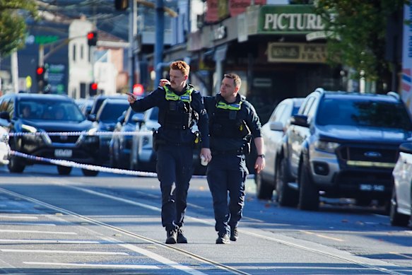 Police at the crime scene on Mount Alexander Road on Sunday morning.