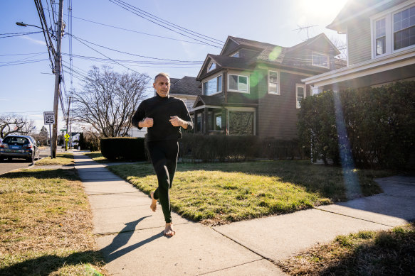 Joseph DeRuvo runs barefoot near his home in Norwalk, Connecticut.