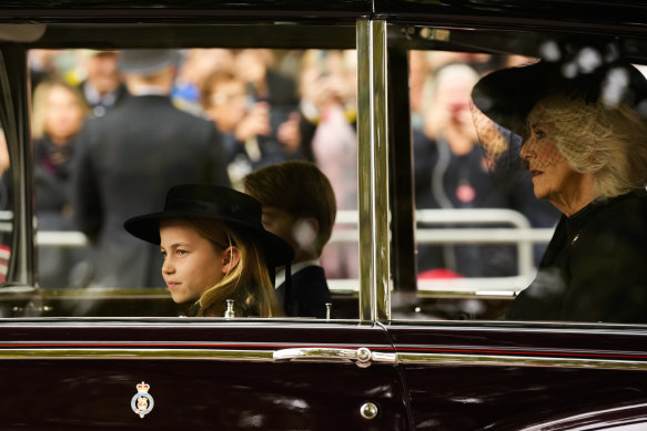 Prince George and Princess Charlotte arrive at Westminster Abbey with Catherine, Princess of Wales (not pictured), and Camilla, Queen Consort.