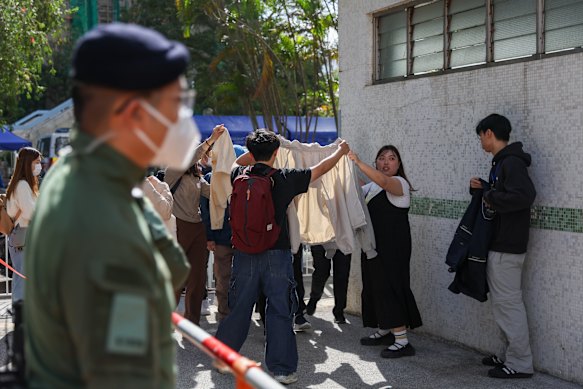 Families had the grim task of looking at photographs of the dead taken by rescue workers.