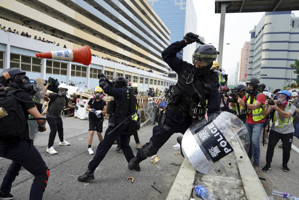 Police and demonstrators clash in Hong Kong on Saturday.
