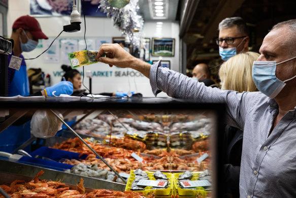 Customers shopping at Queen Victoria Market.