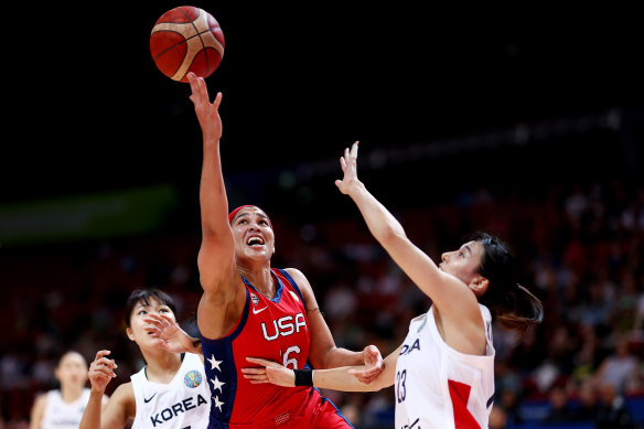 Sabrina Ionescu of the US and Danbi Kim of Korea compete for a rebound.
