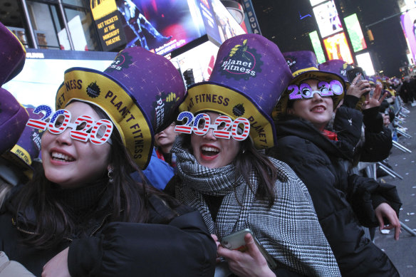 Natsumi Ishikawa and Minori Kondo from Nagoya in Japan count down to the new decade at New York's Time Square.