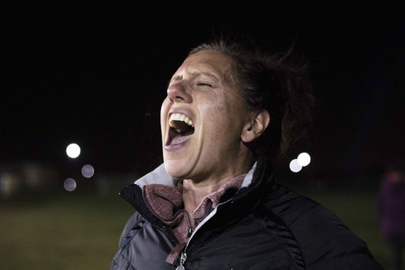 Lindsay Farley participates in a group scream at the Zionsville Youth Soccer Fields in Whitestown.