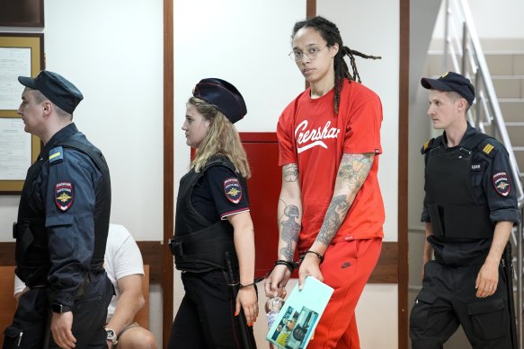 WNBA star and two-time Olympic gold medallist Brittney Griner is escorted to a courtroom for a hearing, in Khimki outside Moscow.