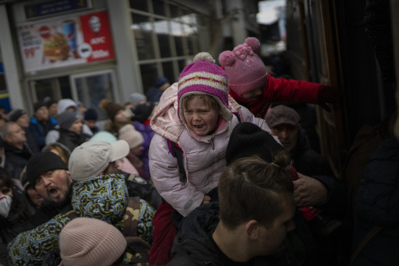 Kyiv’s train station has been packed with people trying to flee before all escape routes are cut off. 