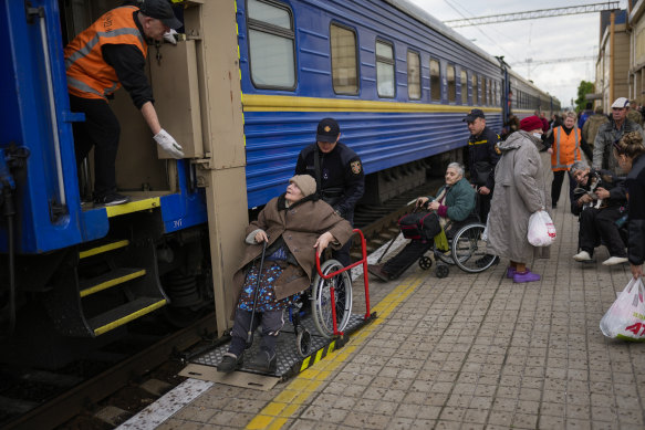 People fleeing from heavy shelling board an evacuation train at Pokrovsk train station, in Pokrovsk, eastern Ukraine, on Sunday.
