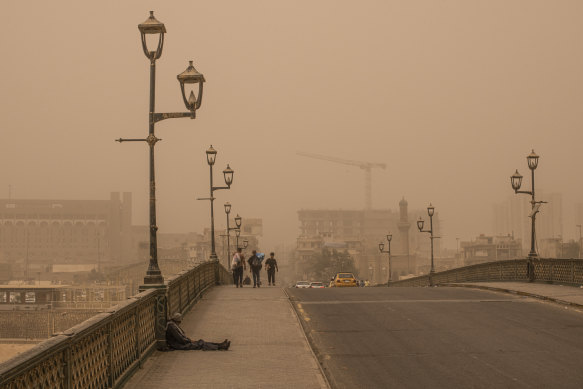 A dust storm in central Baghdad. Now nearly 40 per cent of Iraq has been overtaken by blowing desert sands that claim another 10,000 hectares every year. 