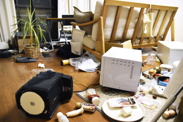 Furniture and electrical appliance are scattered at an apartment in Fukushima on Thursday.