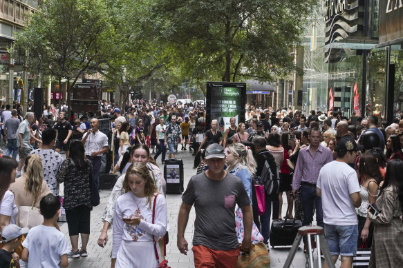 Shoppers rushed to Pitt Street Mall for last-minute Christmas shopping on December 23.