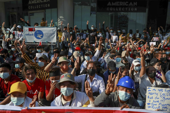 Demonstrators flash a three-finger salute, a symbol of resistance, during a protest in Yangon, Myanmar, on Wednesday.