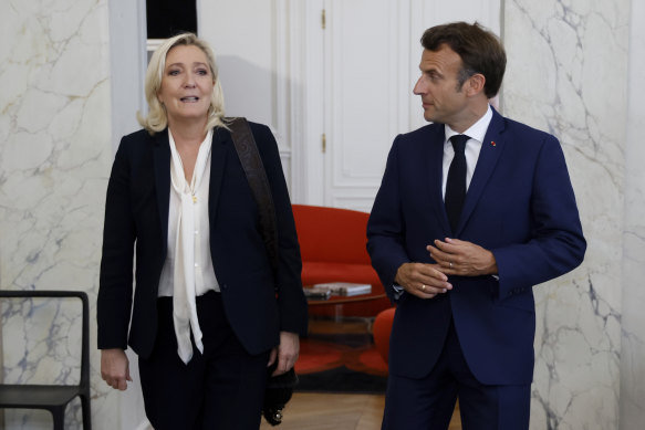 French President Emmanuel Macron meets Le Pen at the Elysee Palace in 2022.