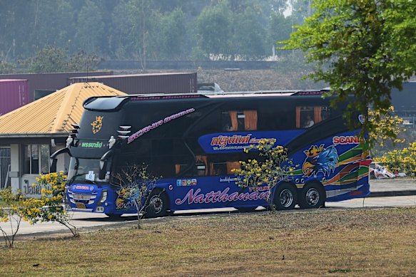 One of nine buses carries freed Indonesian trafficking victims from Myanmar to Mae Sot, in Thailand, in March.