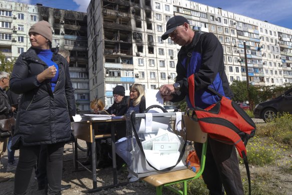 People vote at a mobile polling station in Mariupol, which is controlled by Russia-backed separatists.