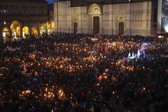 People gather for a candlelight procession in Bologna, Italy, following the Russian attack on Ukraine.