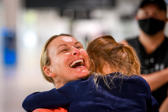 Melanie Brisbane-Schilling is reunited with her six-year-old daughter at Melbourne Airport earlier this morning. 