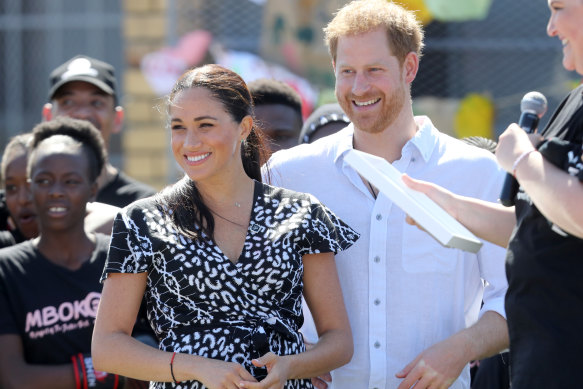 Harry and Meghan visit a township during their royal tour of South Africa.
