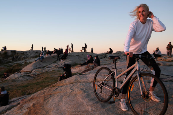 On Friday, Genevieve Quigley watches the sun rise in Maroubra as she marks one year off the booze. 
