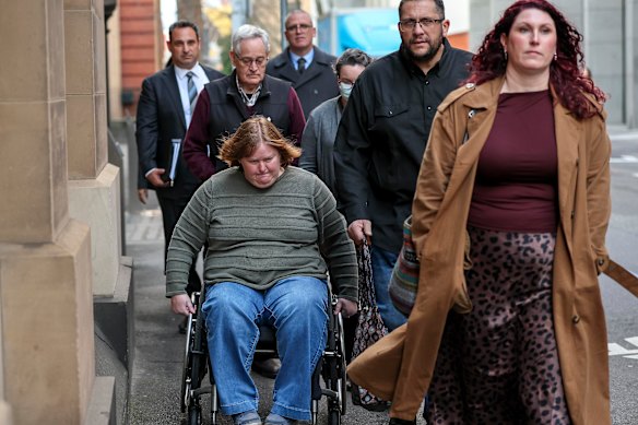Ian Wilkinson and family members leave court on Wednesday.