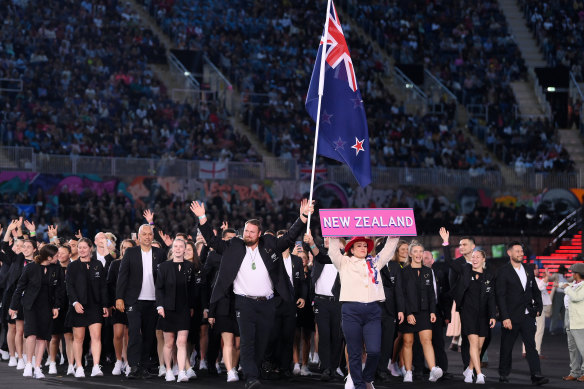 Tom Walsh, flag bearer of Team New Zealand leads the team out during the opening ceremony.