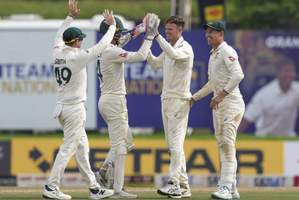 Matthew Kuhnemann (third from left) was central to Australia’s win, with nine wickets for the match