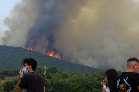 A wildfire advances near a residential area in Alhaurin de la Torre, Malaga, Spain, on Saturday.