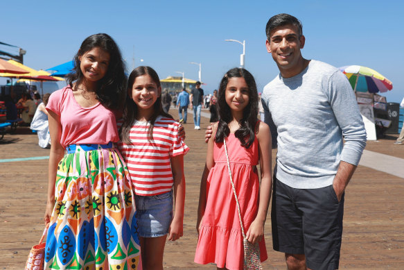 British Prime Minister Rishi Sunak, his wife Akshata Murty and his daughters Anoushka Sunak and Krishna Sunak pose for a photo at Santa Mo<em></em>nica Pier in Santa Monica, California on Thursday.