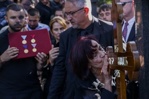 Mladić’s wife Bosiljka and son Darko at the cemetery on Monday,