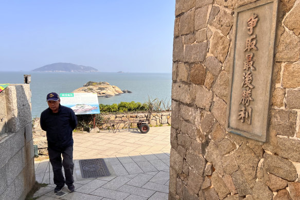 A man walks past a propaganda slogan which reads “Fight for the ultimate victory” in Qinbi Village on Beigan, part of Matsu Islands, Taiwan, last week. The islands are closer to China than Taiwan.