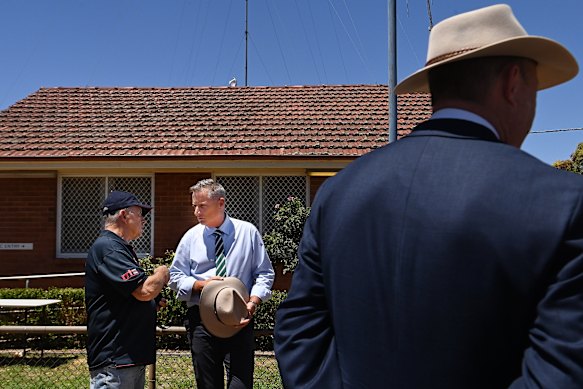 A Rapid Relief Team member (left) talks with National Party Federal Member for Parkes, Jamie Chaffey, at the Lake Cargelligo police station during the search for alleged murderer Julian Ingram in January.