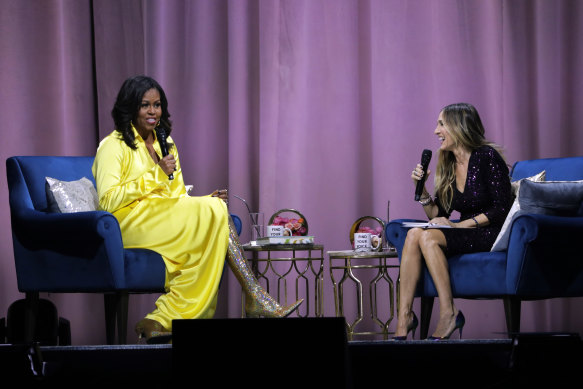 Former first lady Michelle Obama (left) is interviewed by Sarah Jessica Parker.