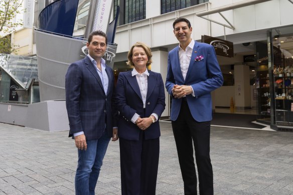 Tattarang chief investment officer John Hartman, director Nicola Forrest and Lord Mayor Basil Zempilas in front of Carillon City arcade, which was emptied to make way for a redevelopment that did not eventuate. 