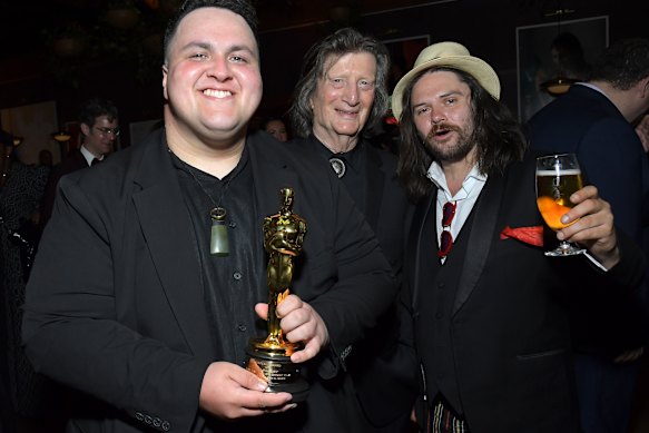 Judah Kelly (left) celebrates with fellow The Singers cast members Chris Smither and Will Harrington at the 2026 Netflix Oscar after-party.