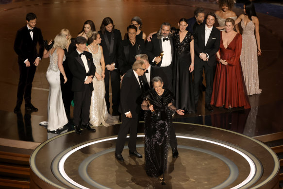 The Oppenheimer cast and crew accept the best picture award.