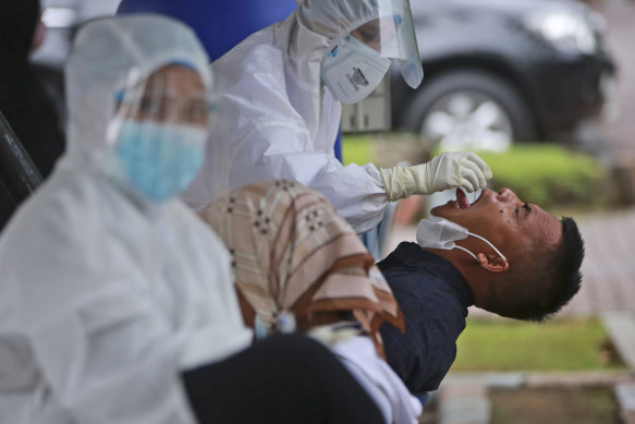 A COVID test in Sumatra, Indonesia. 