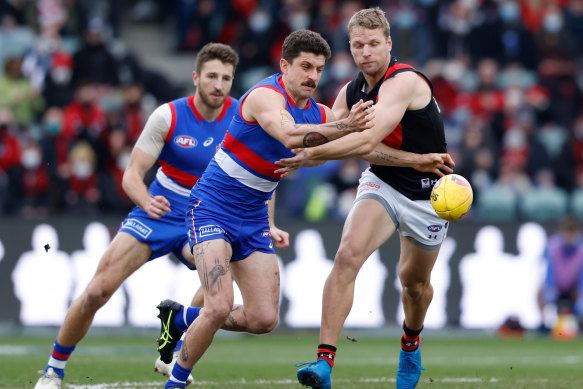 Jake Stringer and Tom Liberatore vie for the ball.