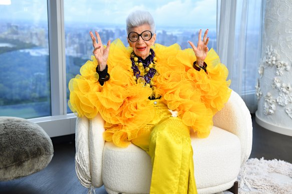 Iris Apfel at her 100th birthday party in  2021. She was known for her love of bright colours and big bangles.