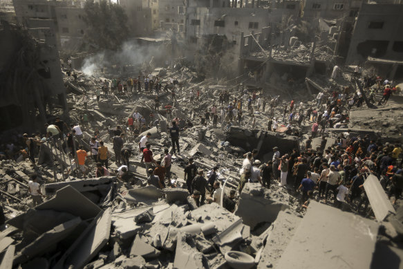  Palestinians inspecting damage to their homes after an Israeli airstrike in Khan Yunis, in the southern Gaza Strip. 
